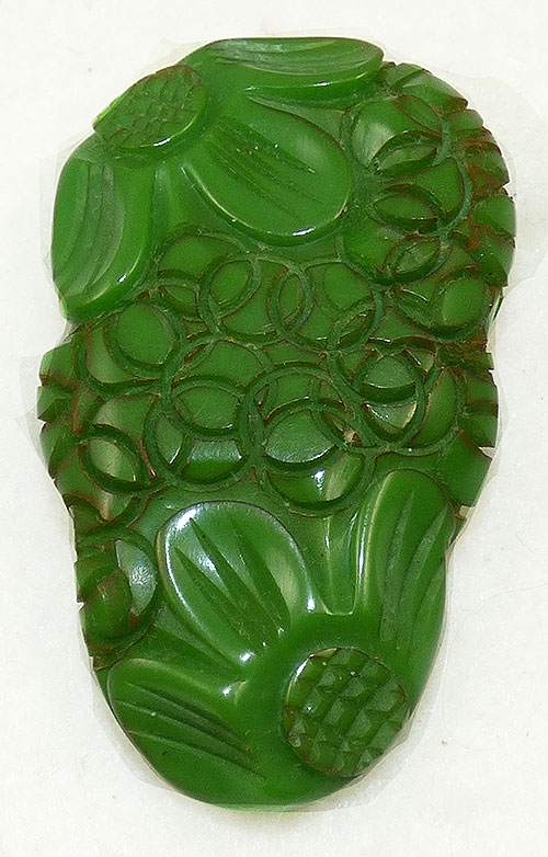 Bakelite, Celluloid, Galalith - Carved Floral Green Bakelite Dress Clip